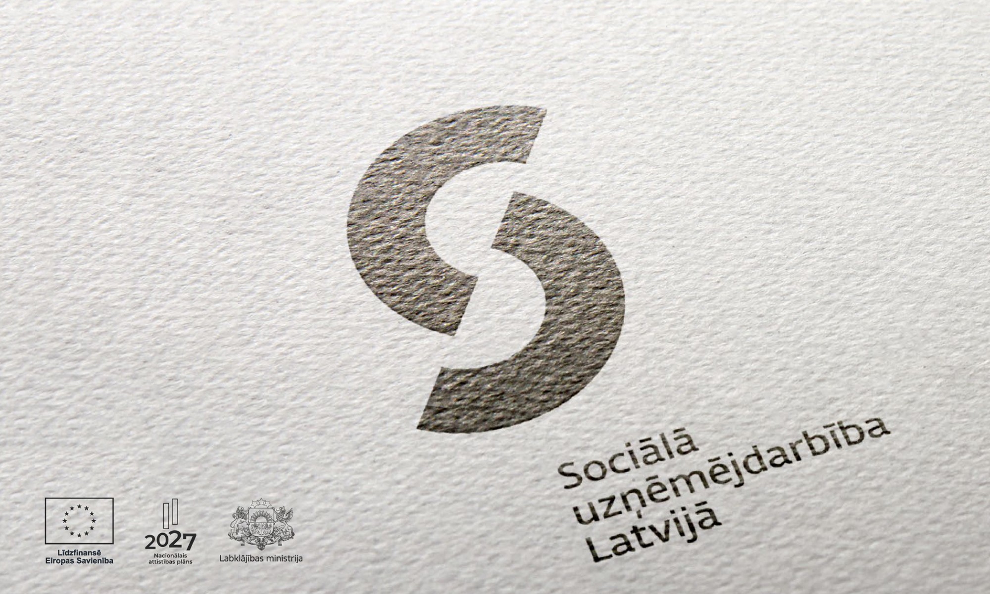 Uzdrukāts uz balta papīra melns Sociālās uzņēmējdarbības Latvijā logotips