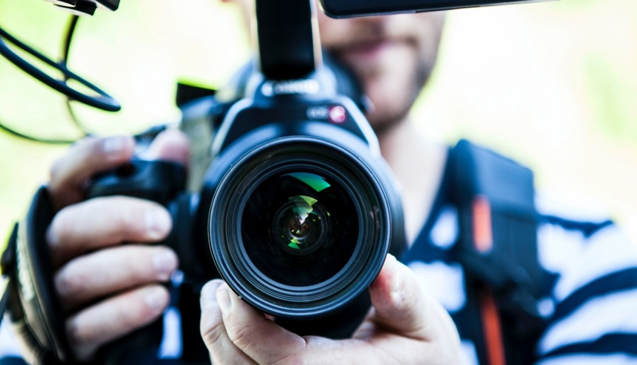 Video camera in a man's hands